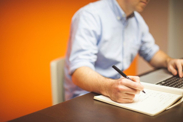 person reading digital safety checklist on laptop in Canadian office